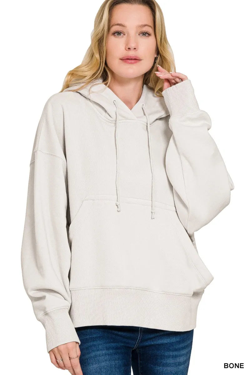 Women's bone colored oversized fleece hoodie with kangaroo pocket and drawstring hood