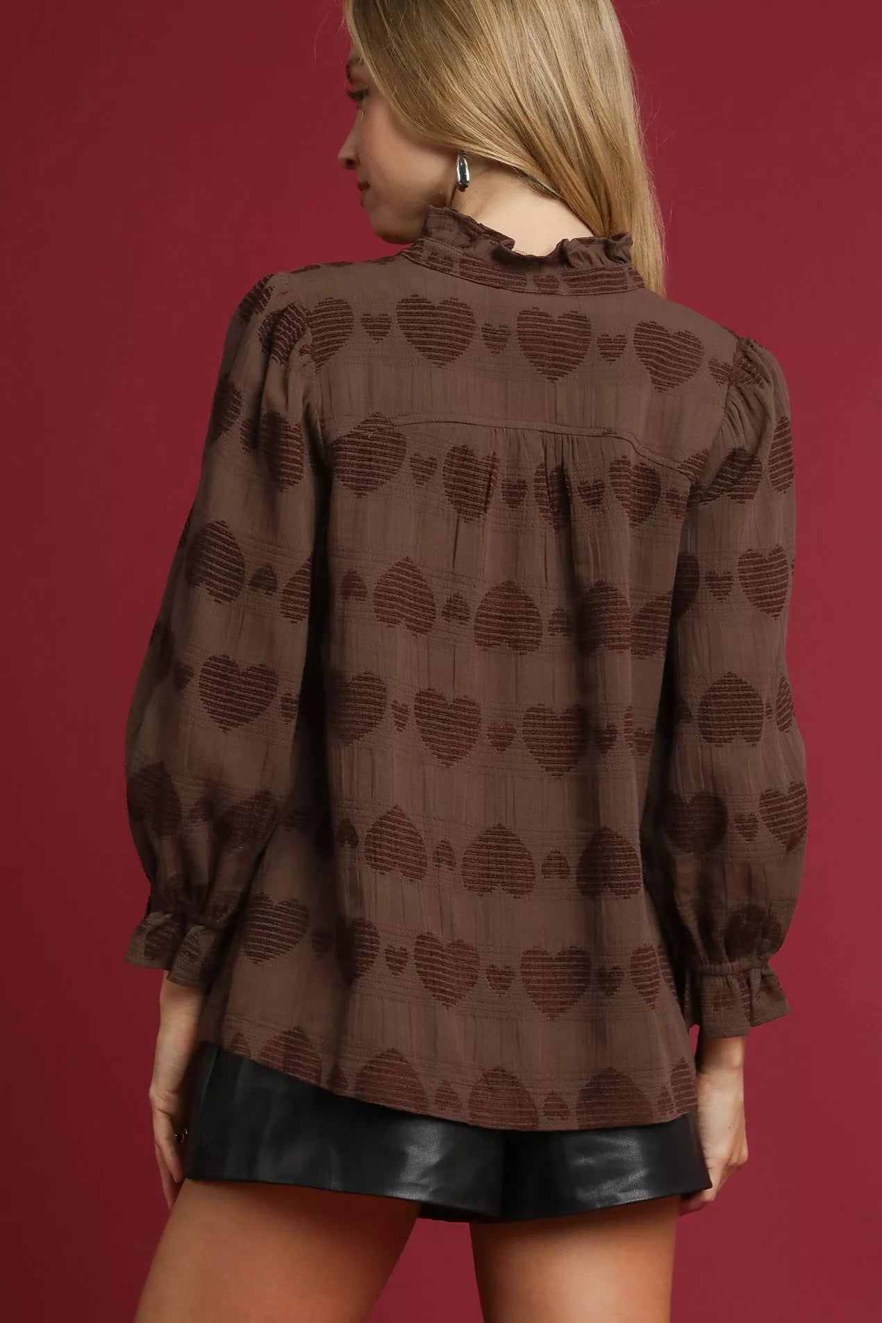 Sarah Express women’s heart jacquard shirt featuring delicate ruffle trim detailing.