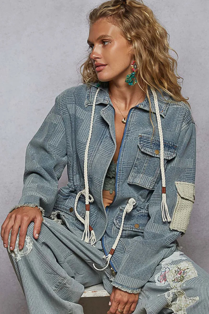 Sarah Express women’s oversized hooded denim jacket with a zip-up front, raw hem, and patchwork details.