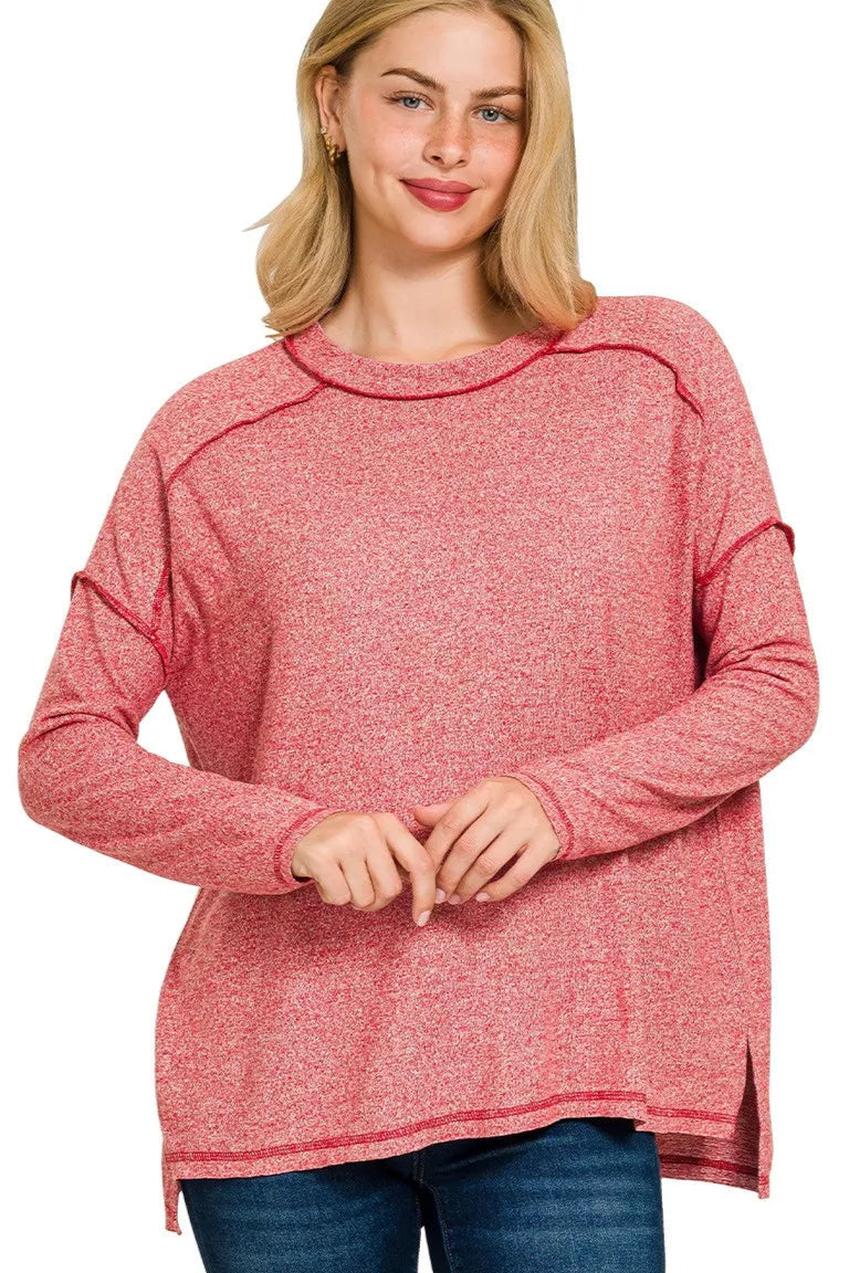 Sarah Express women’s plus size melange hacci tee with edgy exposed seams and a hi-low hem.