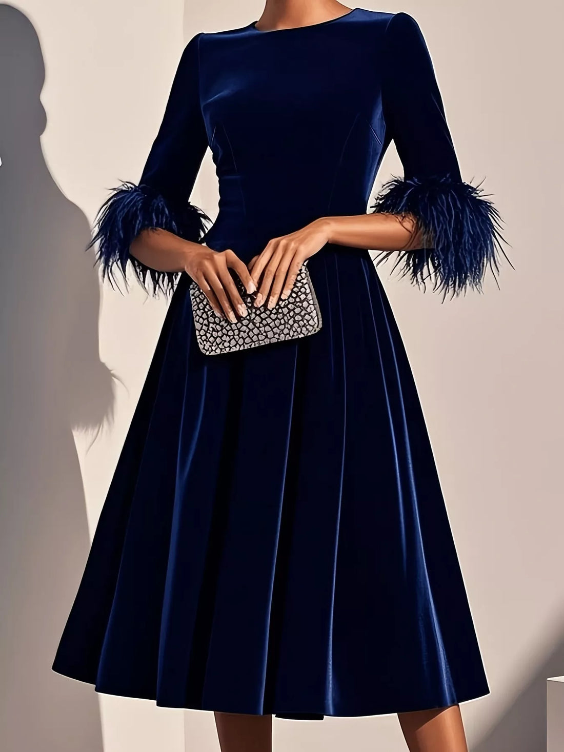 Luxurious velvet midi dress with dramatic feather cuffs for evening events