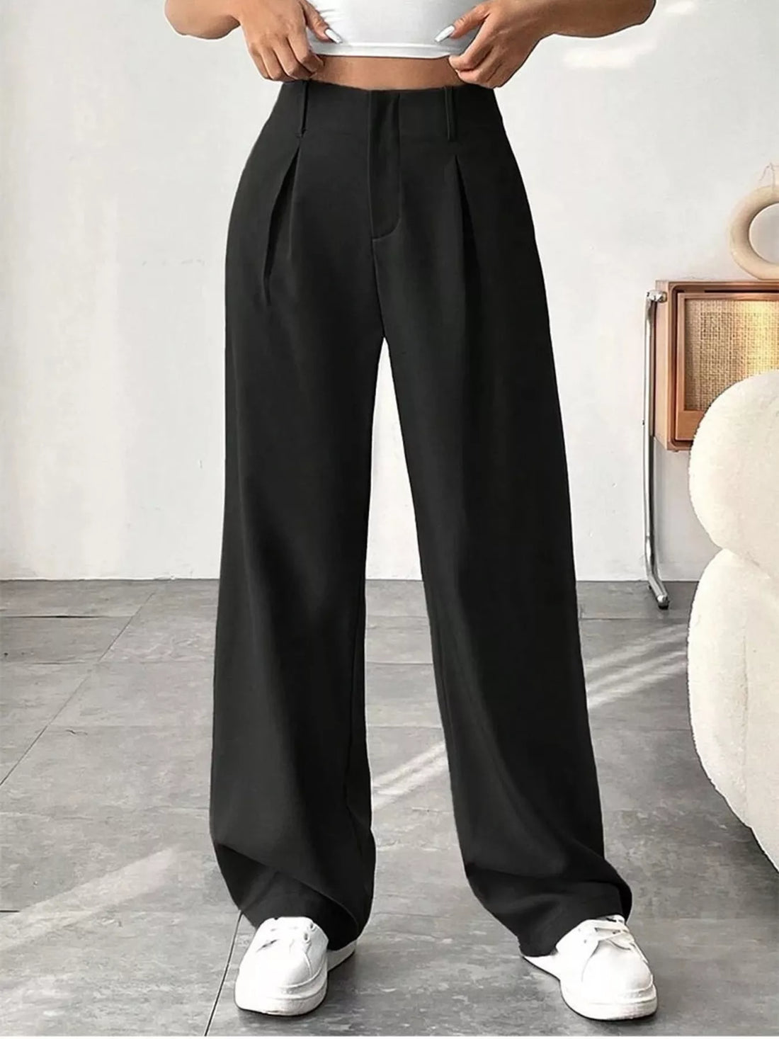 Women's wide leg pleated pants styling guide featuring elegant black and ivory white options