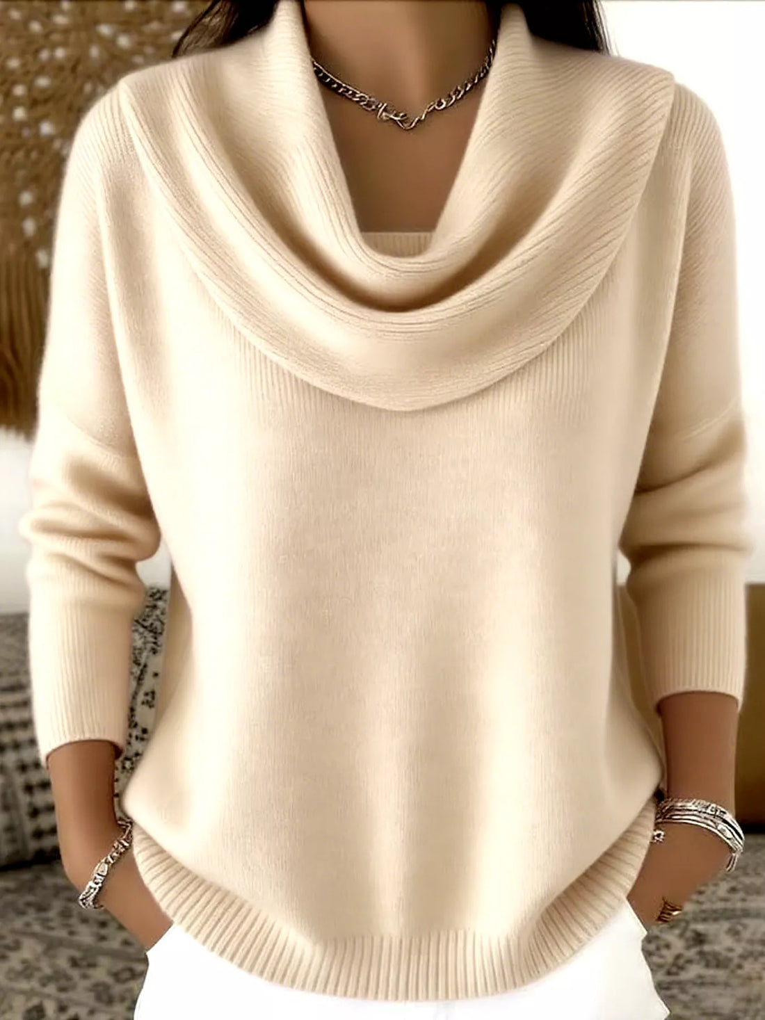 Woman wearing elegant cowl neck sweater in apricot color showcasing plus size fashion