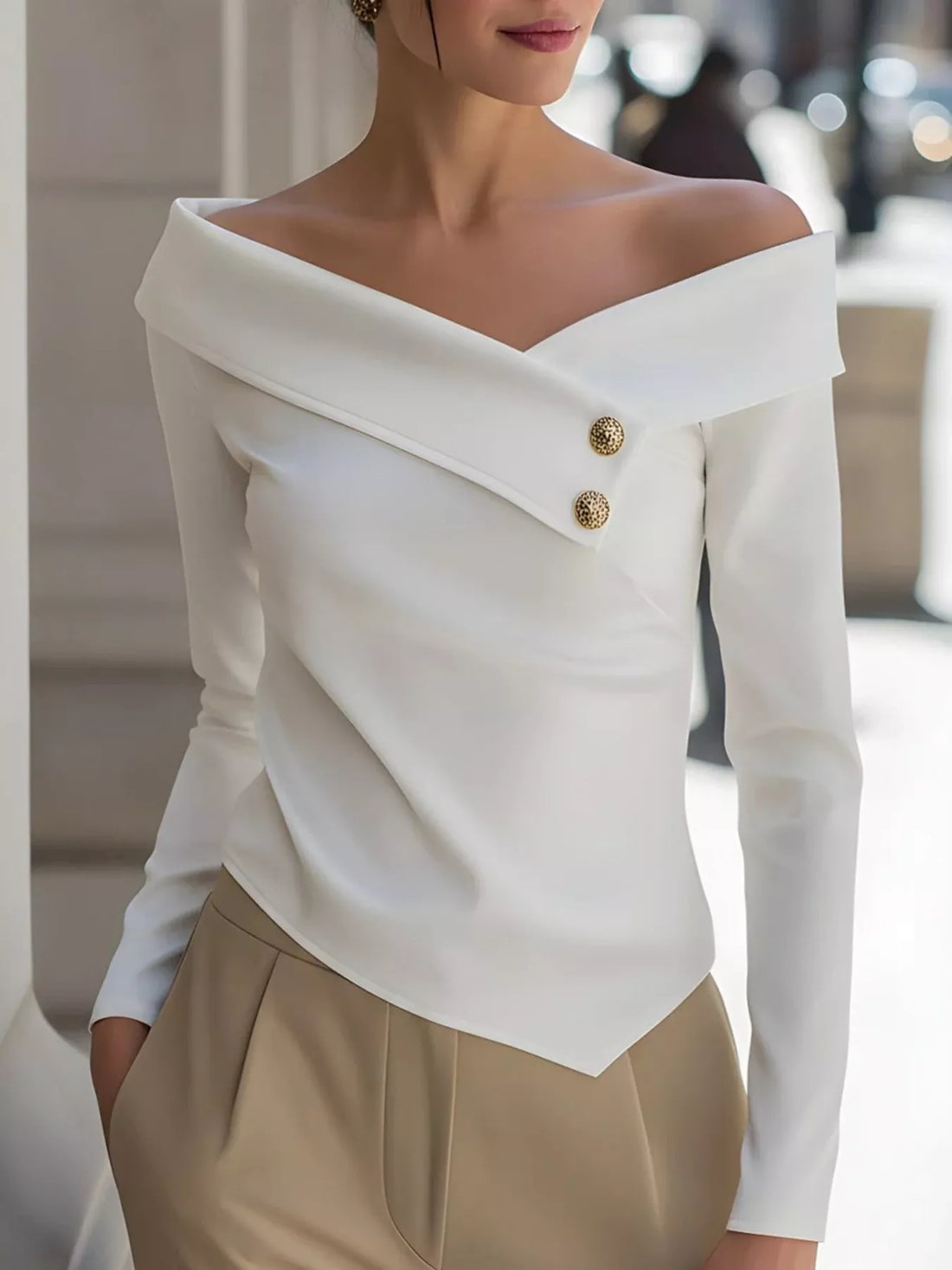 Elegant woman wearing white off-shoulder button decor blouse