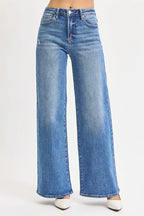 Sarah Express women’s plus size high rise wide leg jeans in a medium blue wash.
