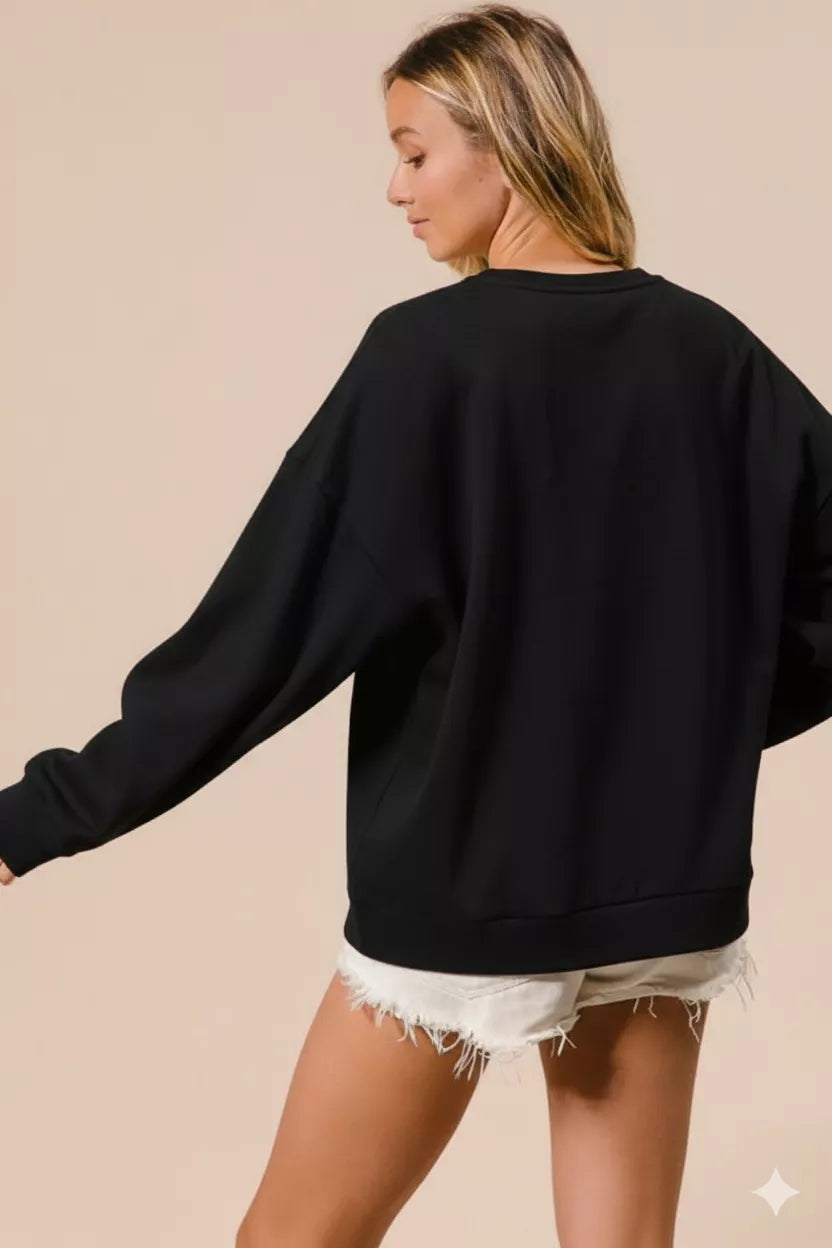 Sarah Express women’s oversized Christmas fleece sweatshirt with plaid "Merry" lettering.
