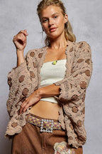 Sarah Express women’s openwork chenille cardigan featuring a V-neck and contrast floral details.
