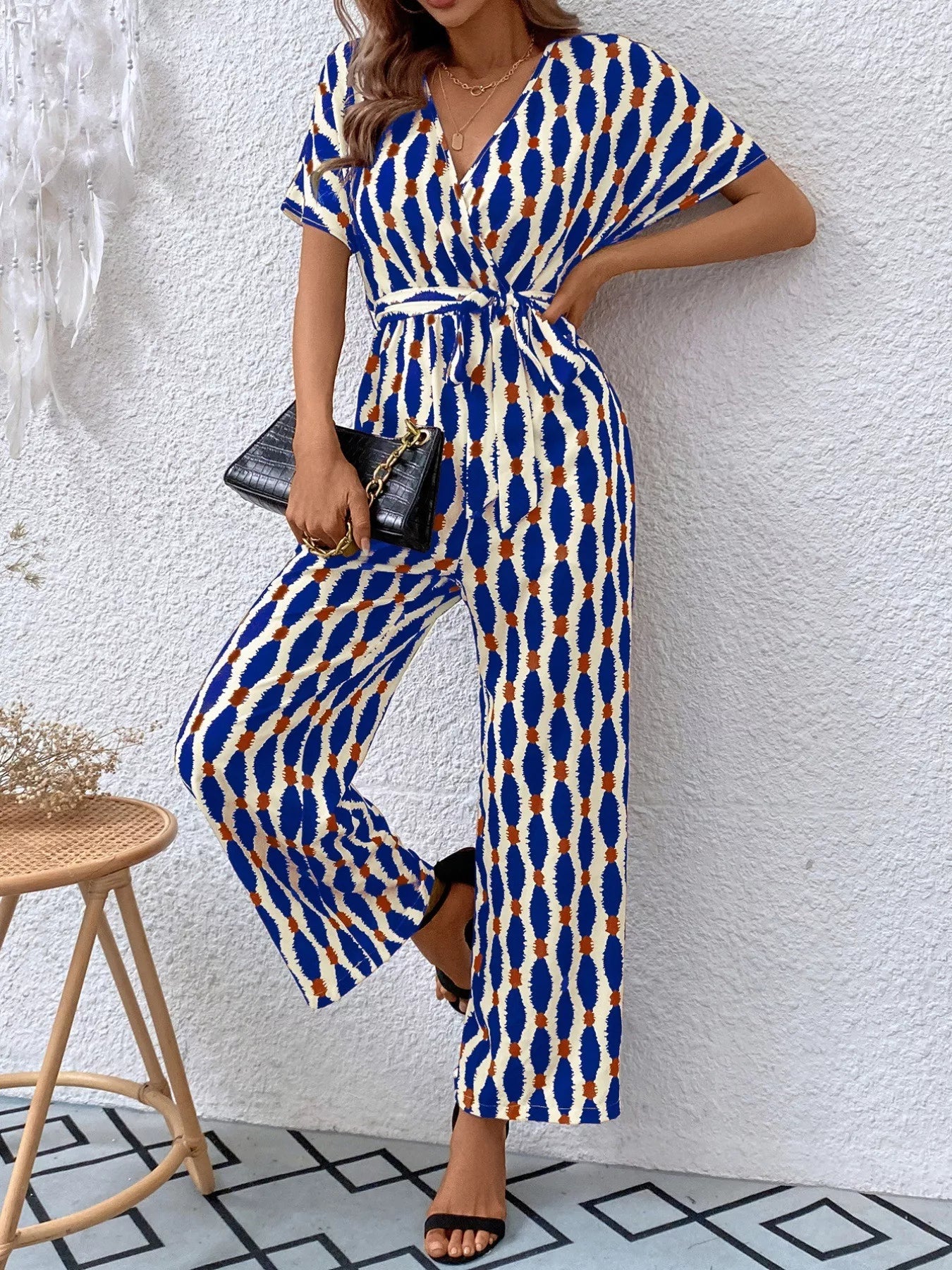 Sarah Express Women's Printed Surplice Tie Waist Short Sleeve Jumpsuit Navy