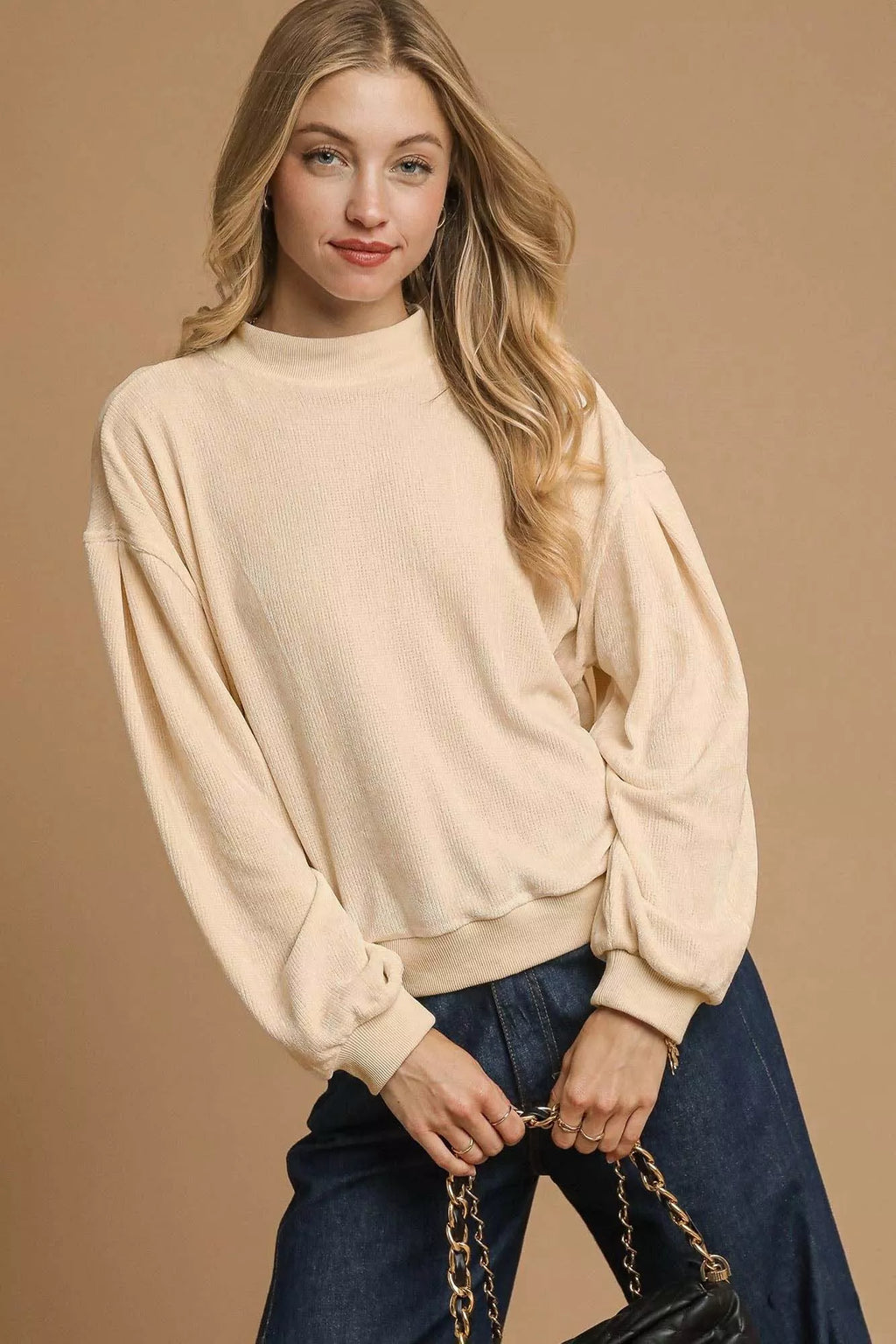 Sarah Express women’s velour crewneck sweatshirt with voluminous balloon sleeves.