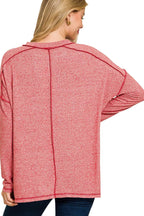 Sarah Express women’s plus size melange hacci tee with edgy exposed seams and a hi-low hem.
