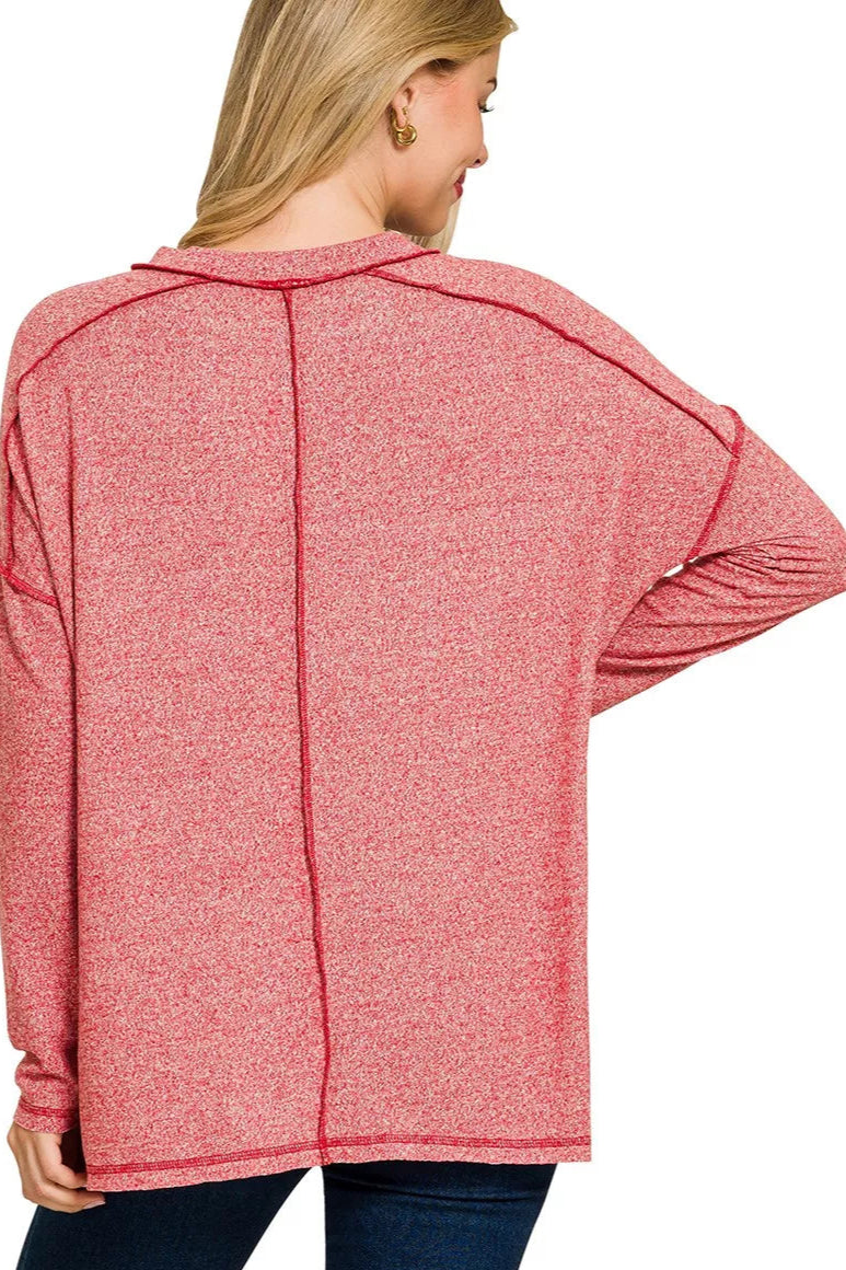 Sarah Express women’s plus size melange hacci tee with edgy exposed seams and a hi-low hem.
