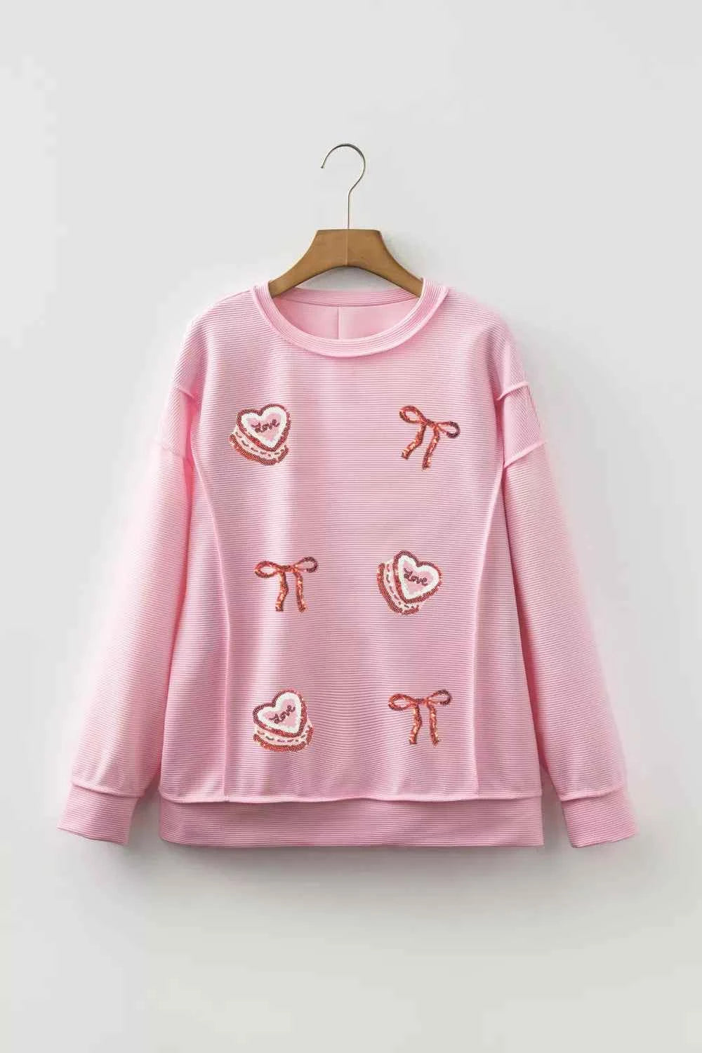 Sarah Express Women's Sequin Love Cake Bow Graphic Long Sleeve Top - Ribbed Texture Exposed Seam