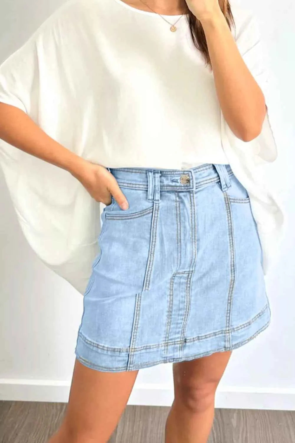 Sarah Express Women's A-Line Denim Mini Skirt with Pockets - Exposed Seam Detail