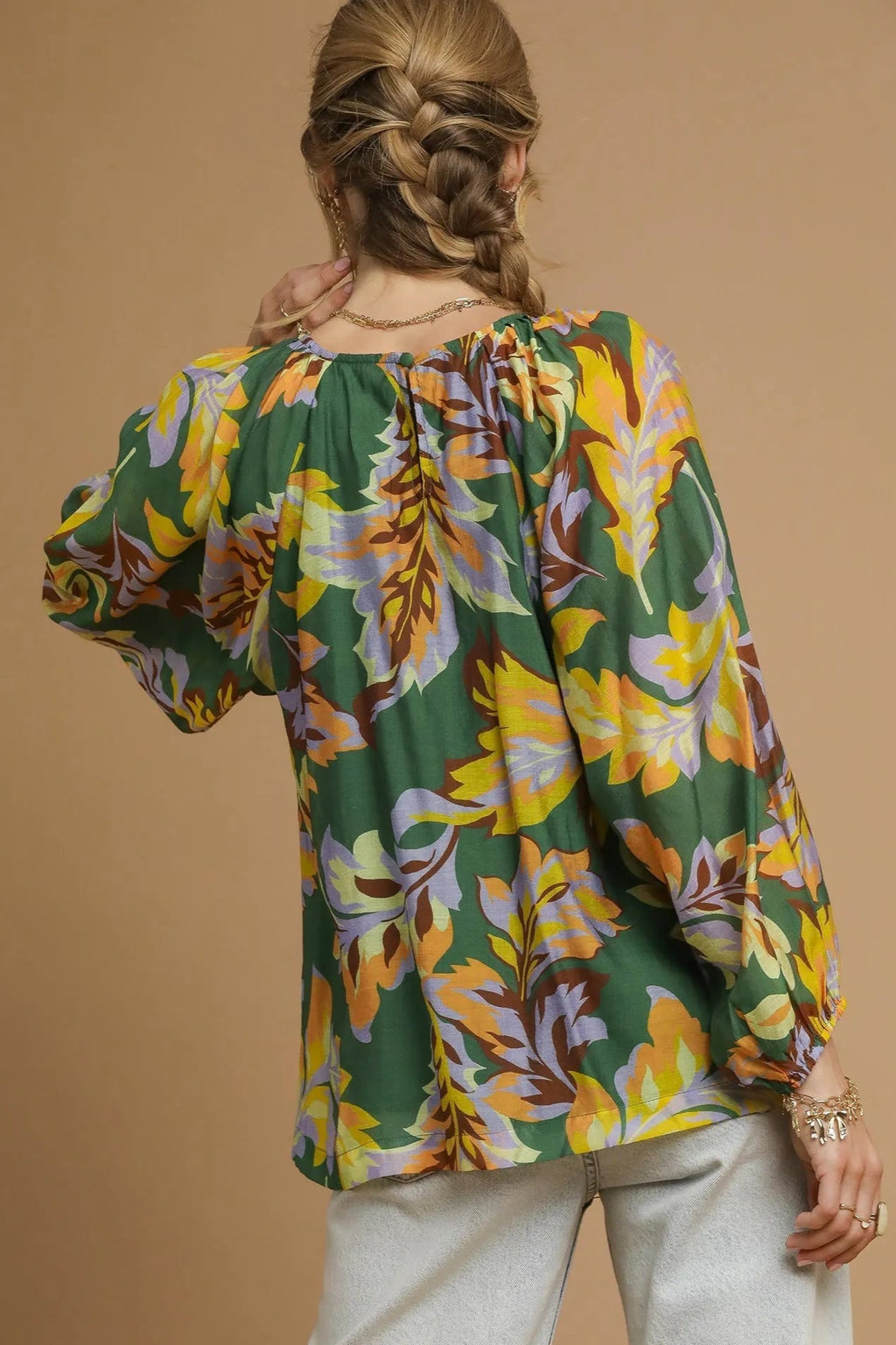 Sarah Express women’s abstract print blouse with dramatic balloon sleeves and ruched details.