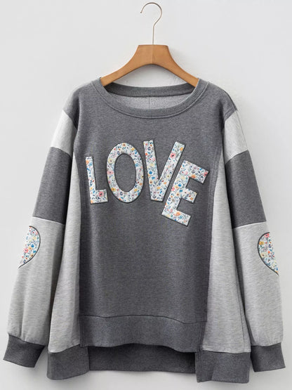 Sarah Express Women's LOVE Graphic Exposed Seam Patchwork Uneven Hem Chic Sweatshirt